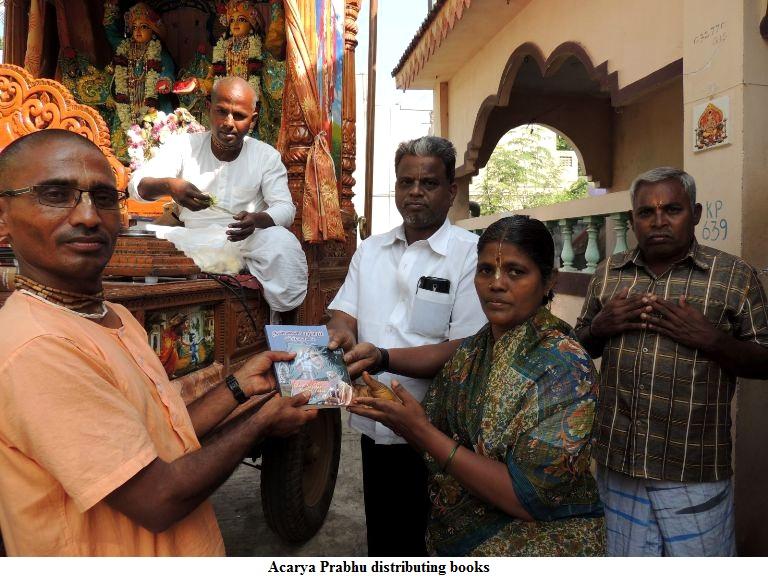 Edited with caption HG_Acharya_Prabhu_giving_book_to_a_Mataji